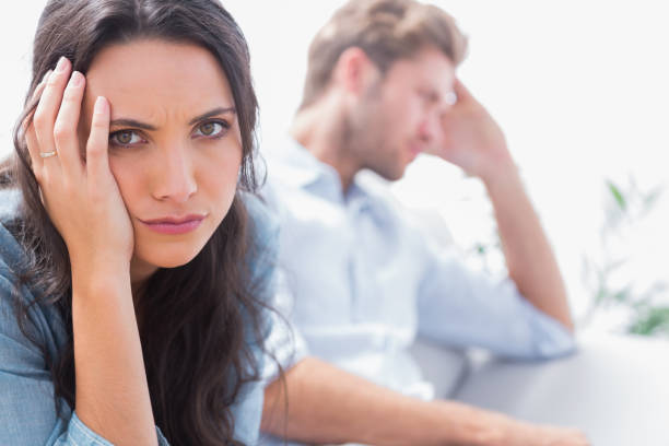 istock Upset woman holding her head 828377114
