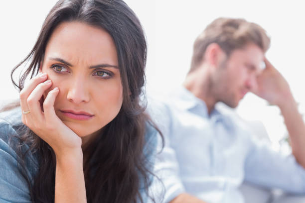 istock Annoyed woman holding her head 828377134