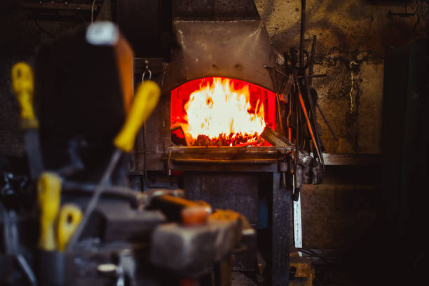 istock Fire in the furnace in the smithy, tools 828377318