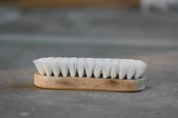 istock Old cleaning brush or washing brush on concrete floor. 828381186