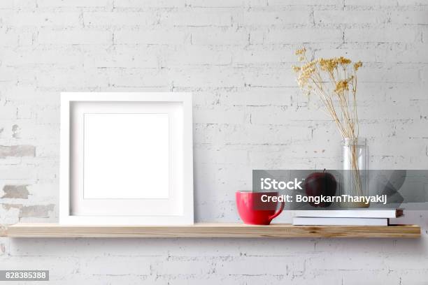 Wood Shelf With Blank White Frame And Coffee Stock Photo - Download Image Now - Picture Frame, Shelf, Wall - Building Feature