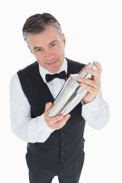 istock Waiter shaking drink in cocktail shaker 828393266
