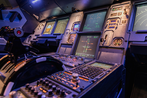 Engine lever in the cockpit of an airliner. Center console and throttles in an old airplane