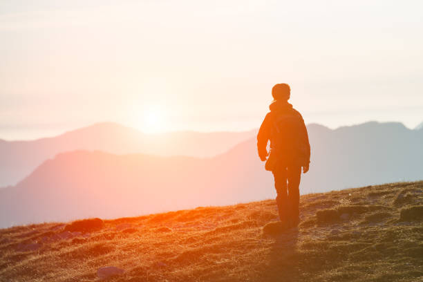 istock Walking to the endless mountains in the sunset colors 828400908