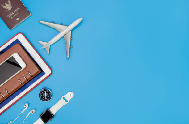 istock Travel accessories and objects for business traveler on blue copy space 828404180