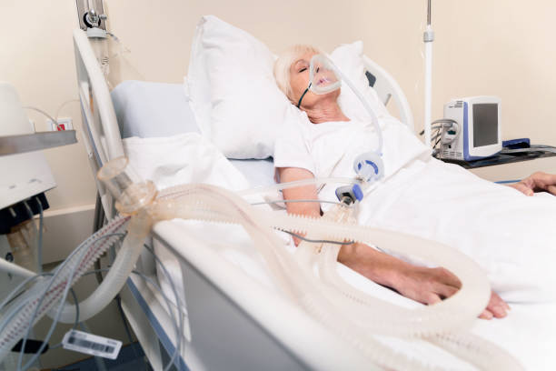 istock Unconscious ailing woman getting necessary life support 828412178