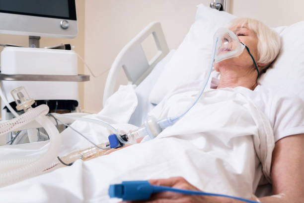 istock Weak ailing woman getting oxygen for recovery 828412938