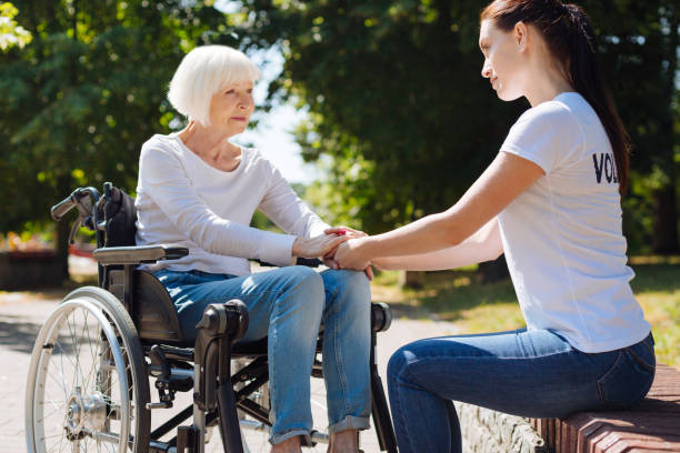 istock Young admirable woman being a psychotherapist for elderly lady 828421650