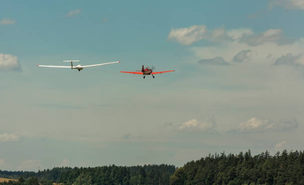 istock towing gliders when starting on a grass runway in sunny day 828423952
