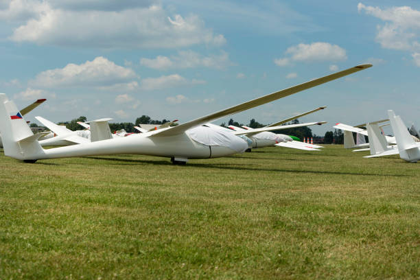 istock gliders at green airfield with blue sky 828424030