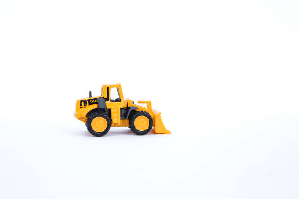 caminhão amarelo carregador frontal isolar no fundo branco - bulldozer earth mover industrial equipment front end loader - fotografias e filmes do acervo