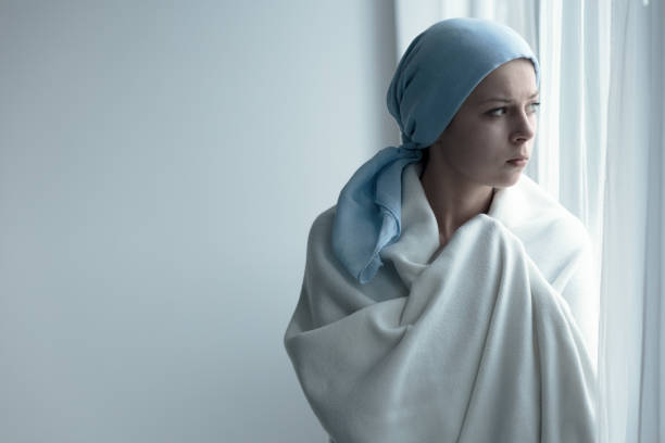 istock Breast cancer patient in blanket 828424156