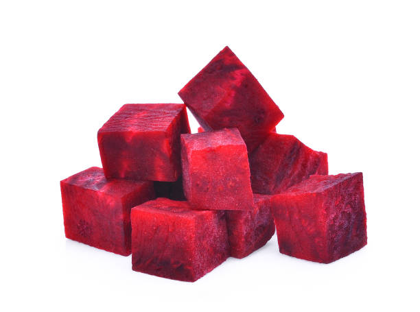 istock pile of cube beetroot isolated on white background 828425340