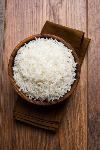 istock basmati rice in a ceramic bowl, indian white and long basmati rice cooked and served in bowl, selective focus 828425808