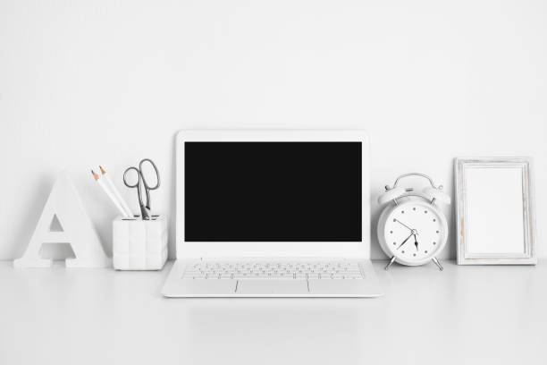 istock Workplace with white laptop on table, education or business concept 828433080