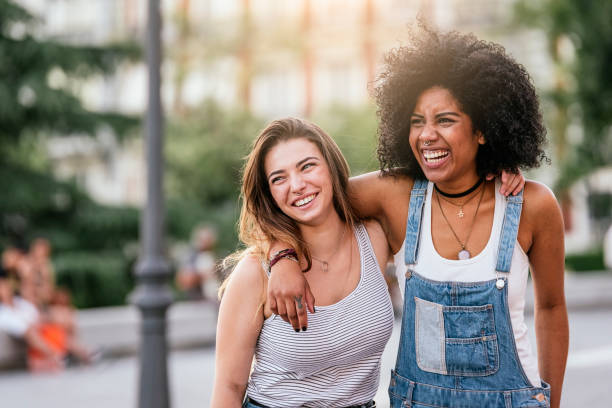 beautiful women having fun in the street. - couple young adult african descent multi ethnic group imagens e fotografias de stock