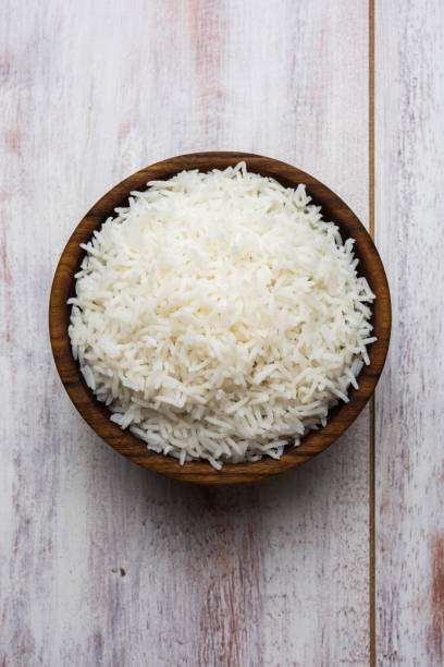 istock basmati rice in a ceramic bowl, indian white and long basmati rice cooked and served in bowl, selective focus 828433492