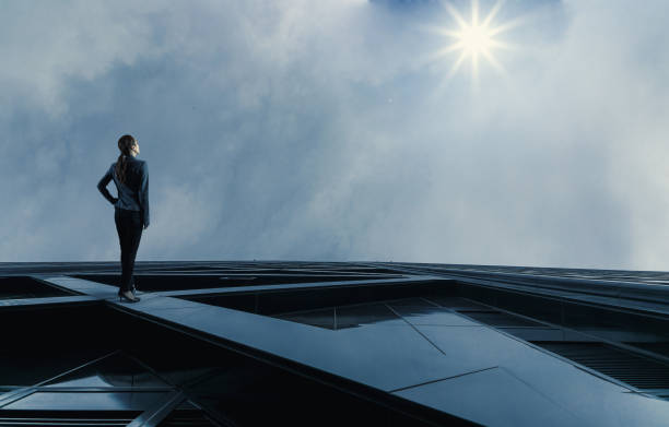 istock business woman standing on modern building. 828435734