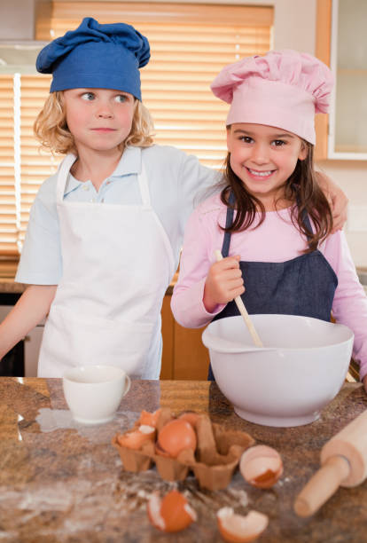 istock Portrait of siblings baking together 828437266