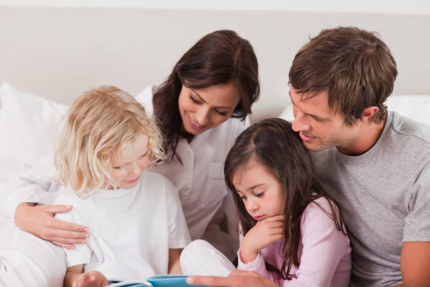 istock Lovely family reading a book 828438032