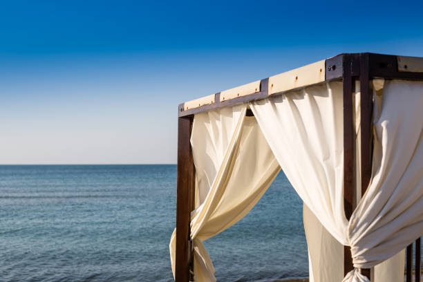 istock White canopie on a beach 828438960