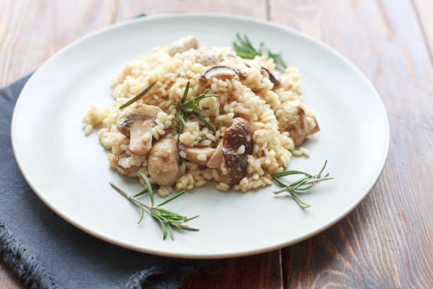 istock Risotto with mushrooms, herbs and parmesan cheese. 828444318