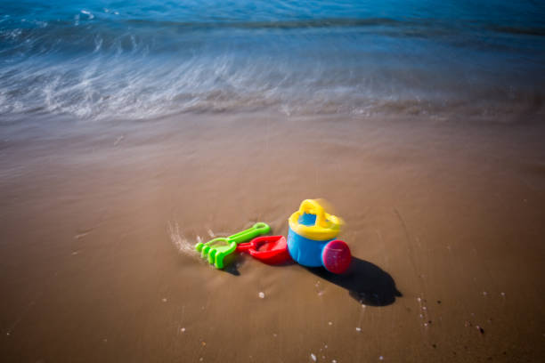 istock Children's beach toys with sea 828447876