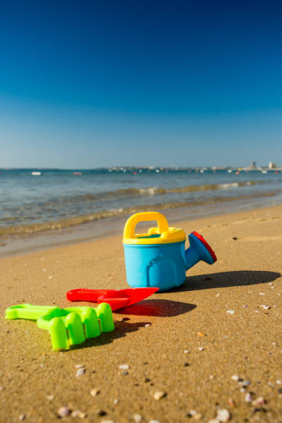 istock Children's beach toys with sea 828448818