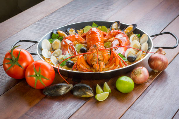 istock Paella with fresh lobster, clams, mussels and squid 828451778