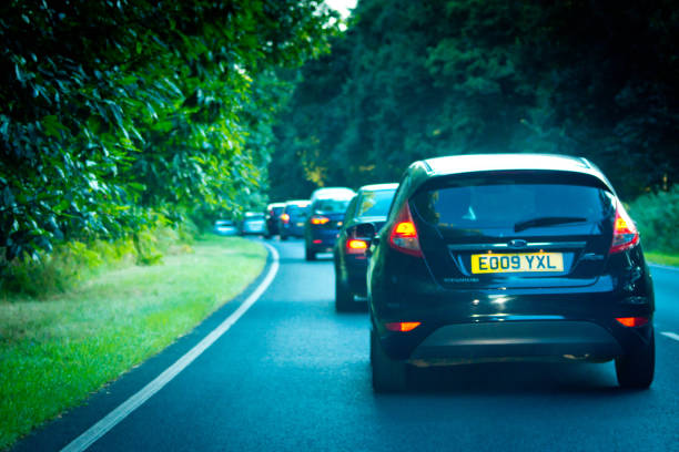 Queue of traffic on the A47 A queue of traffic on the A 47 which is the main road through Norfolk to the coast.  All of the cars are braking as the queue comes to a standstill. ford crossing stock pictures, royalty-free photos & images