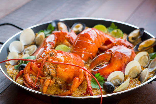 istock Paella with fresh lobster, clams, mussels and squid 828451990