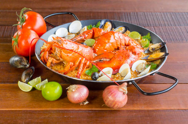 istock Paella with fresh lobster, clams, mussels and squid 828452124