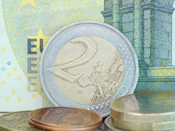 istock Euro coins on paper euro banknotes 828452144