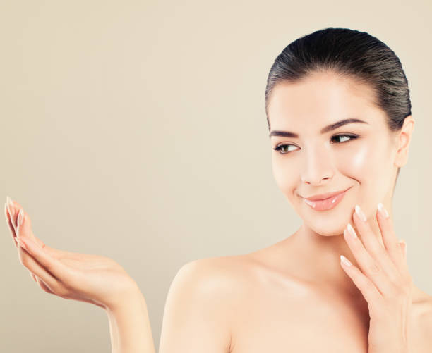 istock Beautiful Fashion Model Woman Showing Empty copy space 828452424