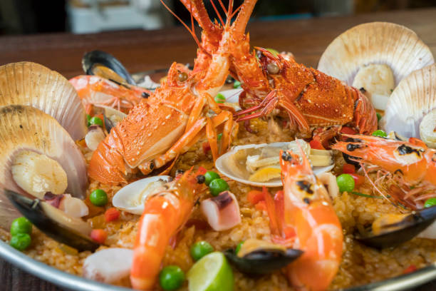 istock Paella with fresh lobster, scallops, mussels and prawn 828455942