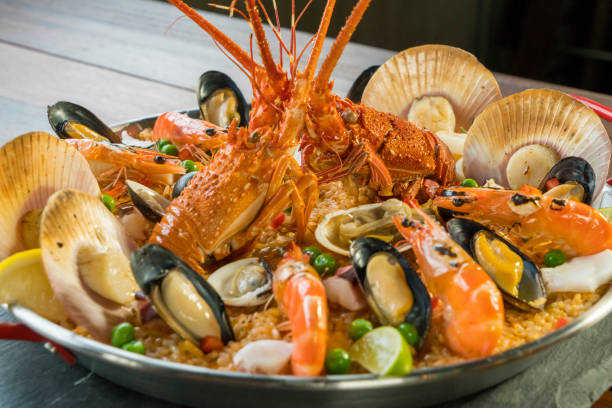 istock Paella with fresh lobster, scallops, mussels and prawn 828456152