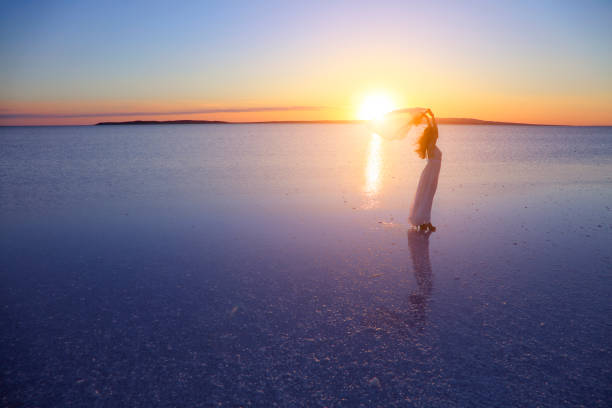 istock Bride holding the flower in Salt lake, Turkey 828461064