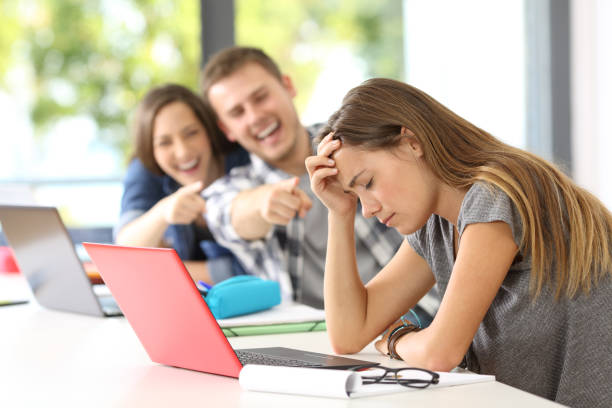 istock Classmates bullying a sad victim 828461288