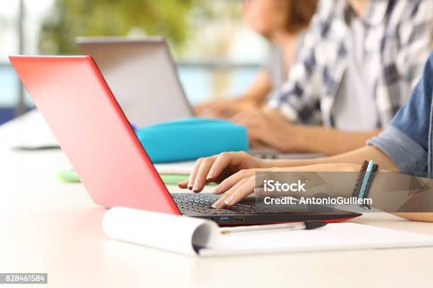 Hands Of Students Learning On Line In A Classroom Stock Photo - Download Image Now - Hand, Teenager, Computer Keyboard