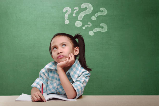 istock Funny expression asian little girl thinking something 828464352