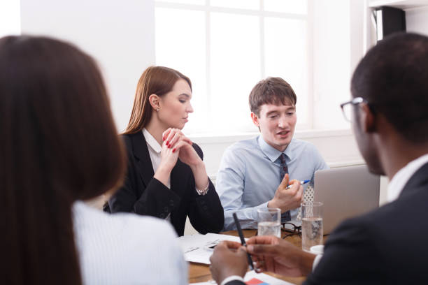 istock Business meeting. Young multiethnic team in modern office 828465104