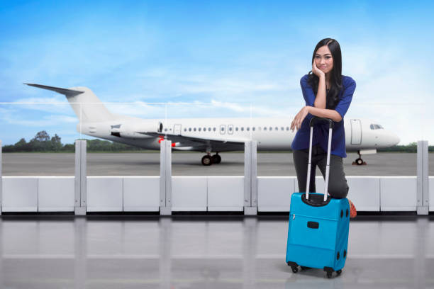 istock Traveler asian woman standing with suitcase 828465140