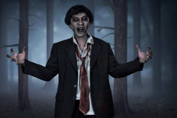 istock Scary asian zombie man wearing suit with open hand 828468080