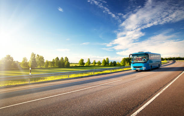 istock Bus on asphalt road in beautiful summer evening 828468100