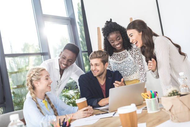 istock business team working on laptop together at workplace in office 828468488
