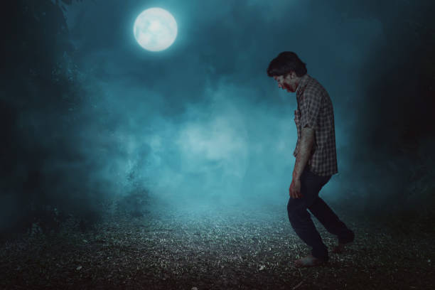 istock Creepy asian zombie man with blood walking 828468986
