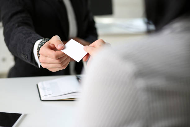 istock Male hand in suit give blank calling card 828469742