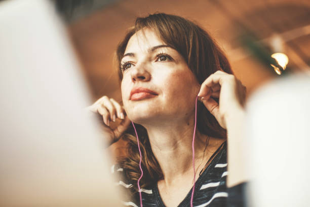 istock Woman with earphones 828469774