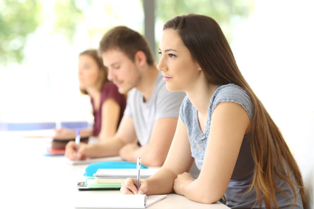 istock Student listening to a lesson in a classroom 828469924