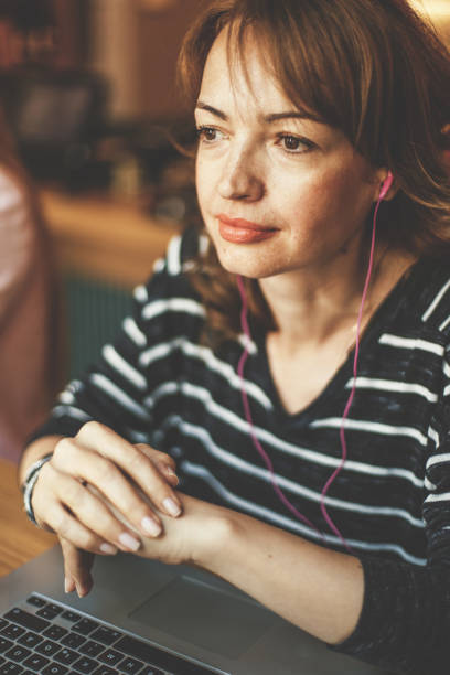 istock Woman with earphones 828469984
